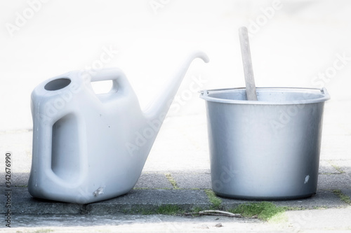 Принти на полотні A bucket and a water jug to wash the windows at a gas station