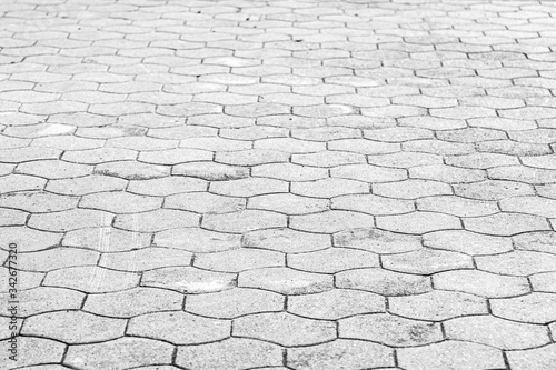 Top view on gray paving stone road. Old pavement of granite texture. Street cobblestone sidewalk. Abstract background for design. photo