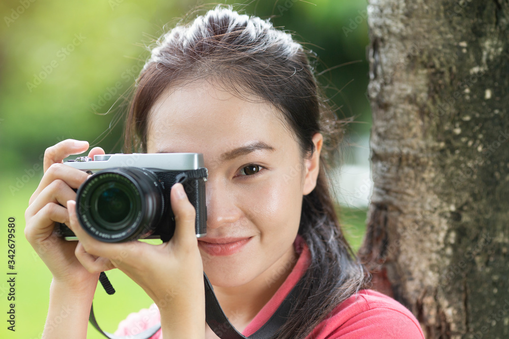 asian woman photographer take a photo with retro camera asian woman photographer take a photo with retro camera