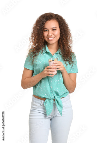 Young woman with tasty yogu...