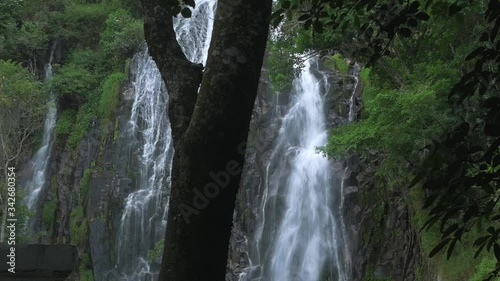 Slow motion: Efrata waterfall in the rainforest highlands near Lake Toba in Sumatra, travel destination, Indonesia. photo