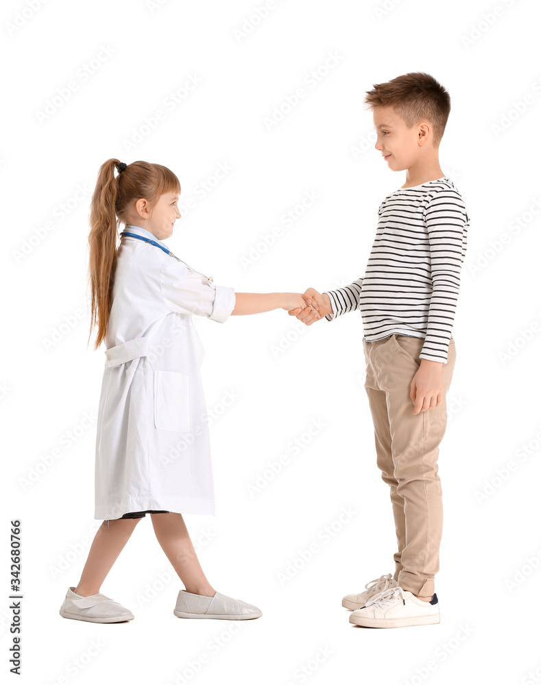 Cute little doctor with patient shaking hands on white background Cute little doctor with patient shaking hands on white background