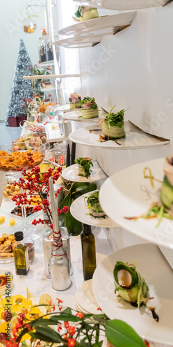 Tasty canapes plates in line hanging with caviar