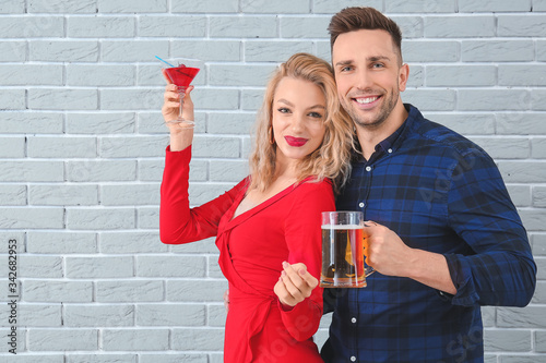Happy couple with glasses o...
