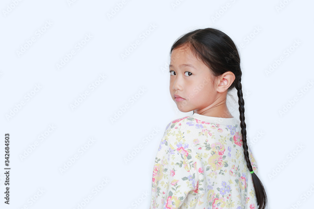 Portraits asian little child girl looking camera from backside isolated on white background with copy space Portraits asian little child girl looking camera from backside isolated on white background with copy space