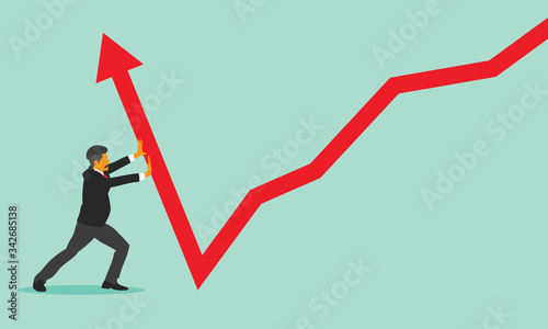 Young businessman pushing a business graph upwards