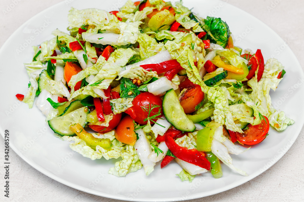 fresh vegetable salad with Beijing cabbage tomatoes and herbs, close-up fresh vegetable salad with Beijing cabbage tomatoes and herbs, close-up