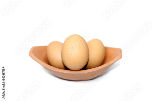 eggs in a bowl isolated on white