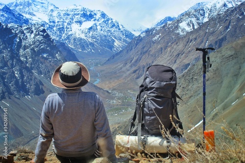 Fotografija trekker and stuffs with a landscape view