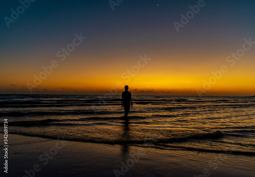 A silhouette of a lady with the sunset sea background at Koh Ta Kiev  Cambodia
