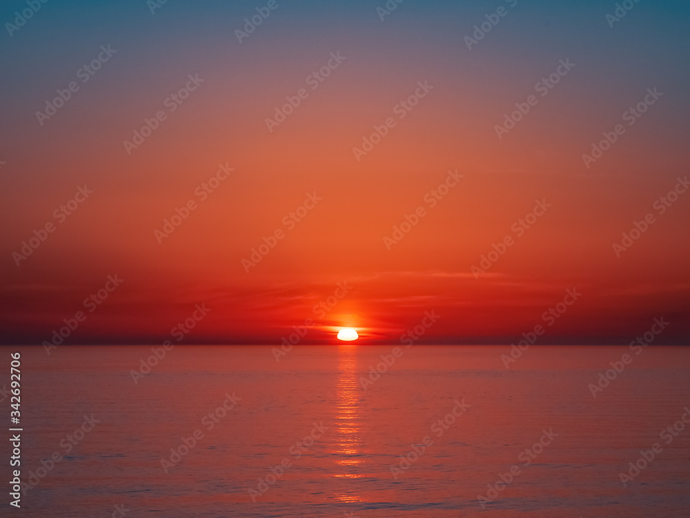 Beautiful bright red sea sunset without people and objects