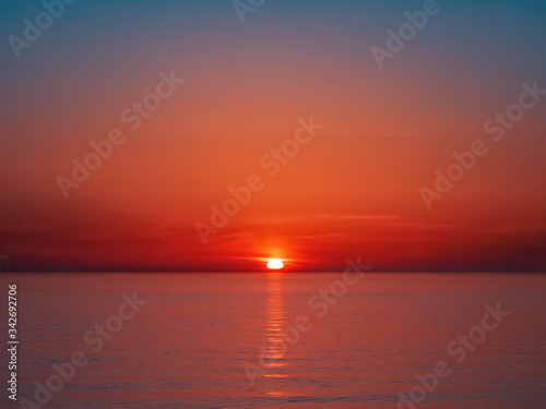 Beautiful bright red sea sunset without people and objects