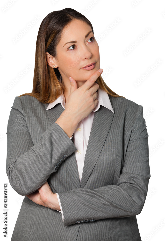 Thinking business woman holding hand under chin and arms folded. Looking to the future with an expression of doubt but a positive attitude. Thinking business woman holding hand under chin and arms folded. Looking to the future with an expression of doubt but a positive attitude.
