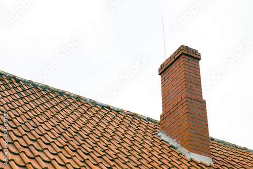 Fotobehang Brick chimney building, house roof