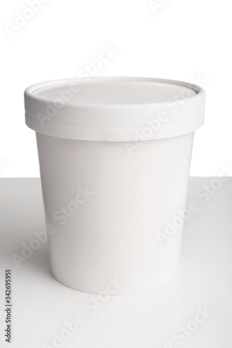 Wallpaper Mural Close-up of blank white paper cup with closed lid on white table isolated on white background Torontodigital.ca
