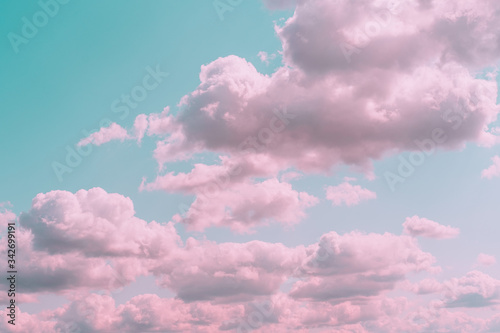 Aesthetic background with beautiful turquoise sky with pink clouds and circle light frame. Minimal creative concept of angel paradise photo