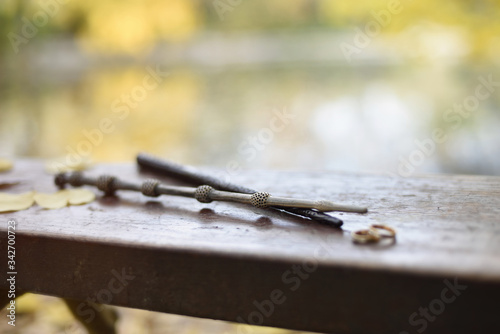 Valokuva Two magic wands in natural landscape with bokeh.