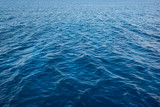 Deep blue aqua sea water surface in perespective texture background