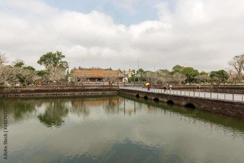 Wonderful view of the “ Meridian Gate Hue “ to the Imperial City with the Purple Forbidden City within the Citadel in Hue, Vietnam. Imperial Royal Palace of Nguyen dynasty in Hue. Hue is a popular
Wonderful view of the “ Meridian Gate Hue “ to the Imperial City with the Purple Forbidden City within the Citadel in Hue, Vietnam. Imperial Royal Palace of Nguyen dynasty in Hue. Hue is a popular