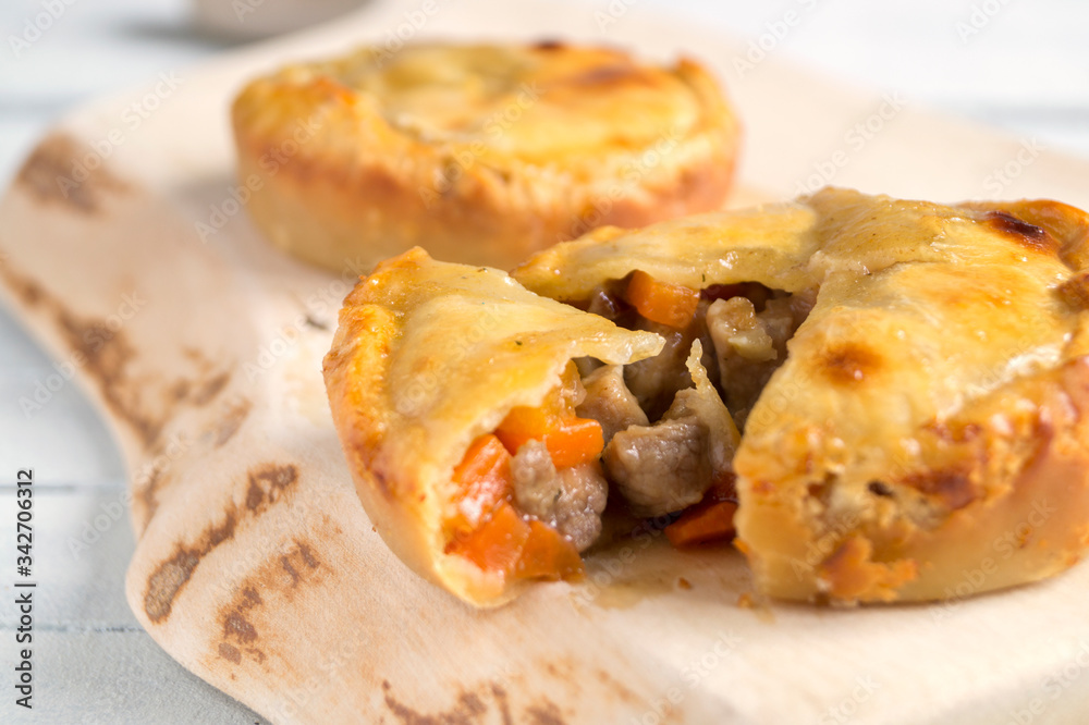 meat pie on wooden table close-up with copy space meat pie on wooden table close-up with copy space