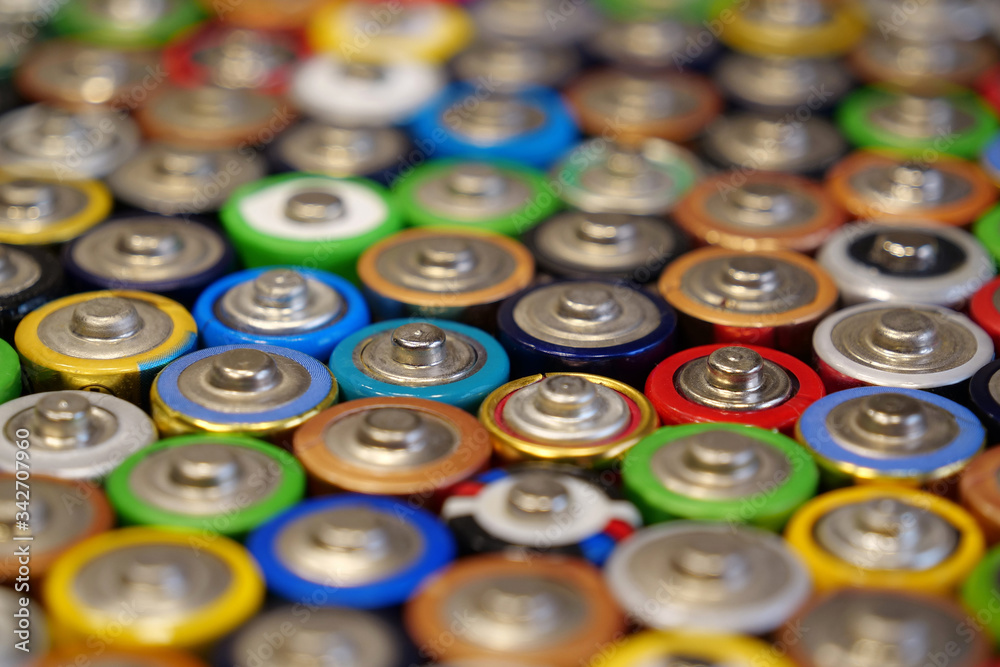 Many multicolored used batteries Many multicolored used batteries