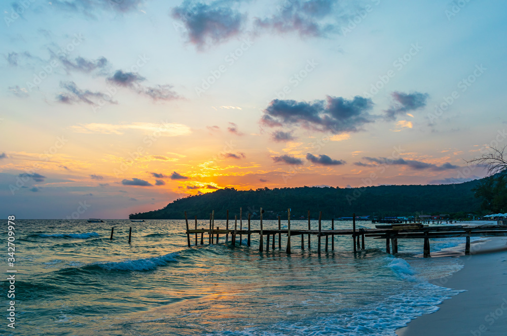 Sok San Beach, Koh Rong, Cambodia- Feb, 2020 : a wooden pier and a beautiful sunset from the Sok San Beach, Koh Rong, Cambodia