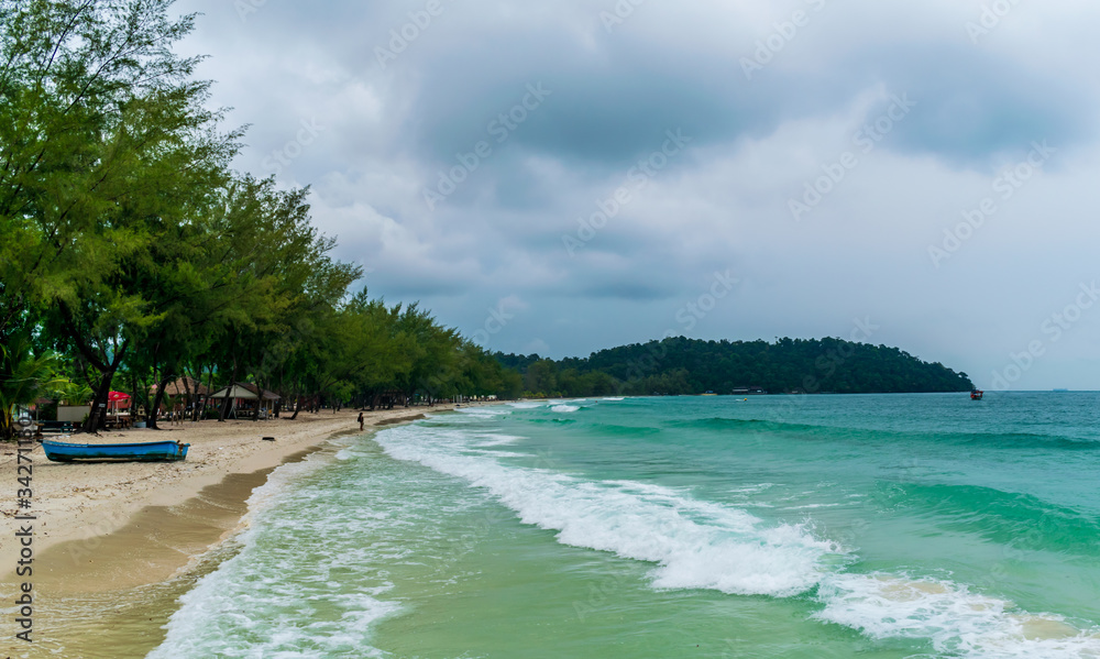 Fototapeta premium Long Set Beach, Koh Rong, Cambodia- Feb, 2020 : a view of some boats on the beach at the Long Set Beach, Koh Rong, Cambodia