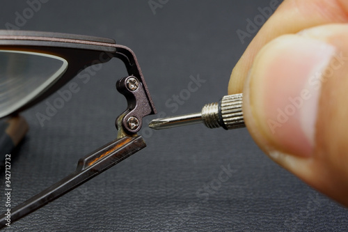 Repairing eyeglass activity with black background
