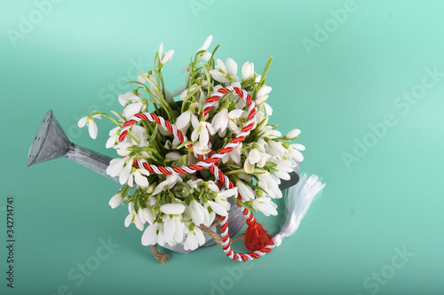 Spring time flowers like snowdrops, hyacinth and roses, isolated on yellow simple background, spring symbol and traditional romanian 