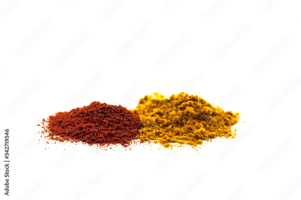 Mix of different powders like paprica and curry isolated on white background Mix of different powders like paprica and curry isolated on white background