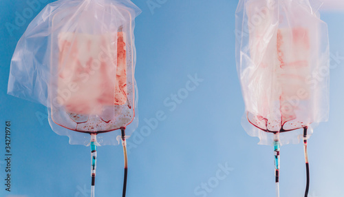 a blood bag for infusion into a clinic. donor blood is administered. photo