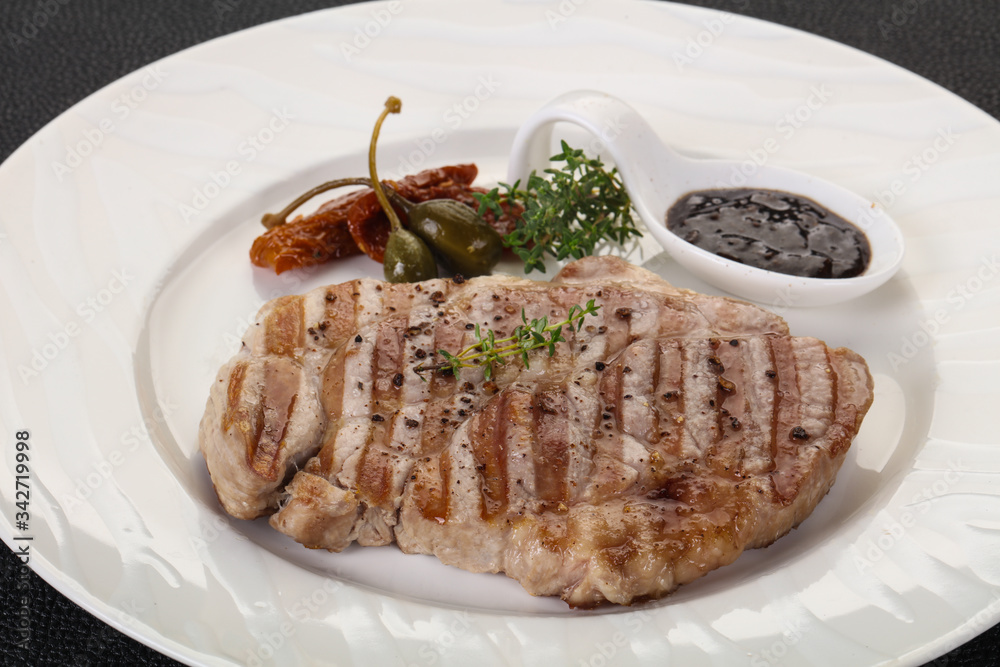 Grilled pork steak with pepper sauce