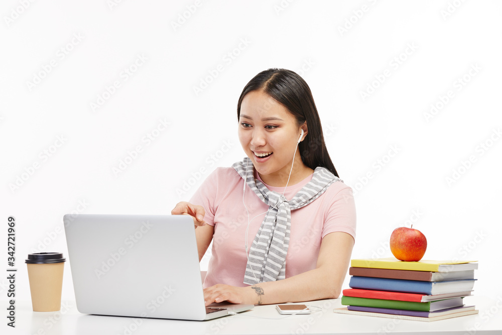 Student studies with the help of her laptop. Student studies with the help of her laptop.