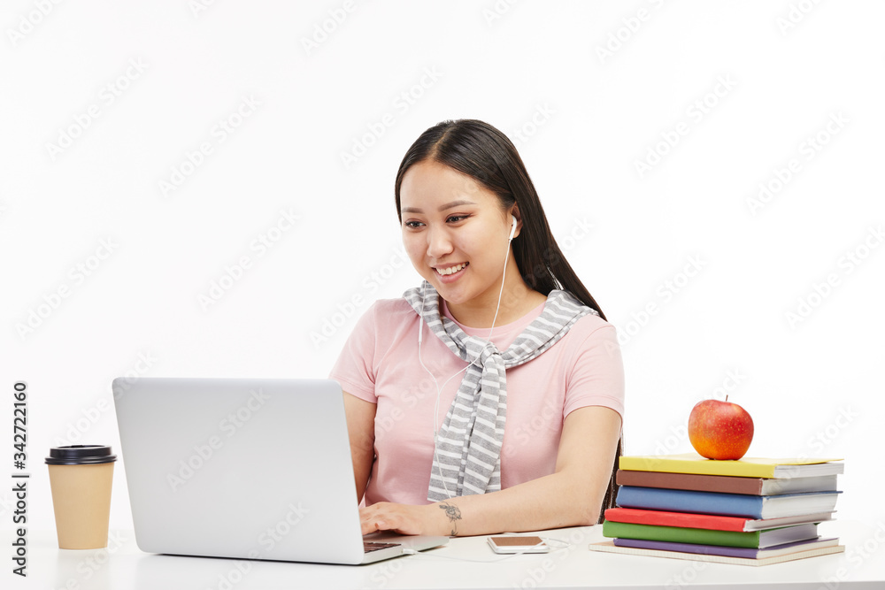 Student uses her portative computer at the classroom. Student uses her portative computer at the classroom.