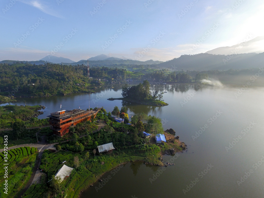 Bandung Indonesia June, 4 2020: Beautiful Lake Patenggang with green tea field in ciwidey Indonesia
