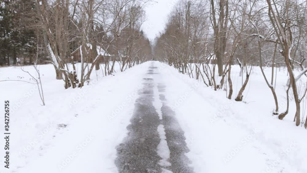 No one on empty street. Quarantine, self isolation, stay home concept. Moving forward road through trees. Beautiful snow season. Outdoor perspective landscape. Stock video. No one on empty street. Quarantine, self isolation, stay home concept. Moving forward road through trees. Beautiful snow season. Outdoor perspective landscape. Stock video.