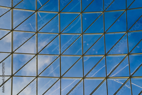 Transparent ceiling. Glass ceiling of the room close-up. Glass over your head. sky panorama