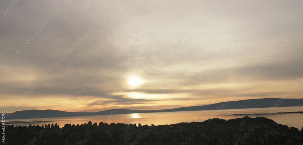 sunset across Belfast shore