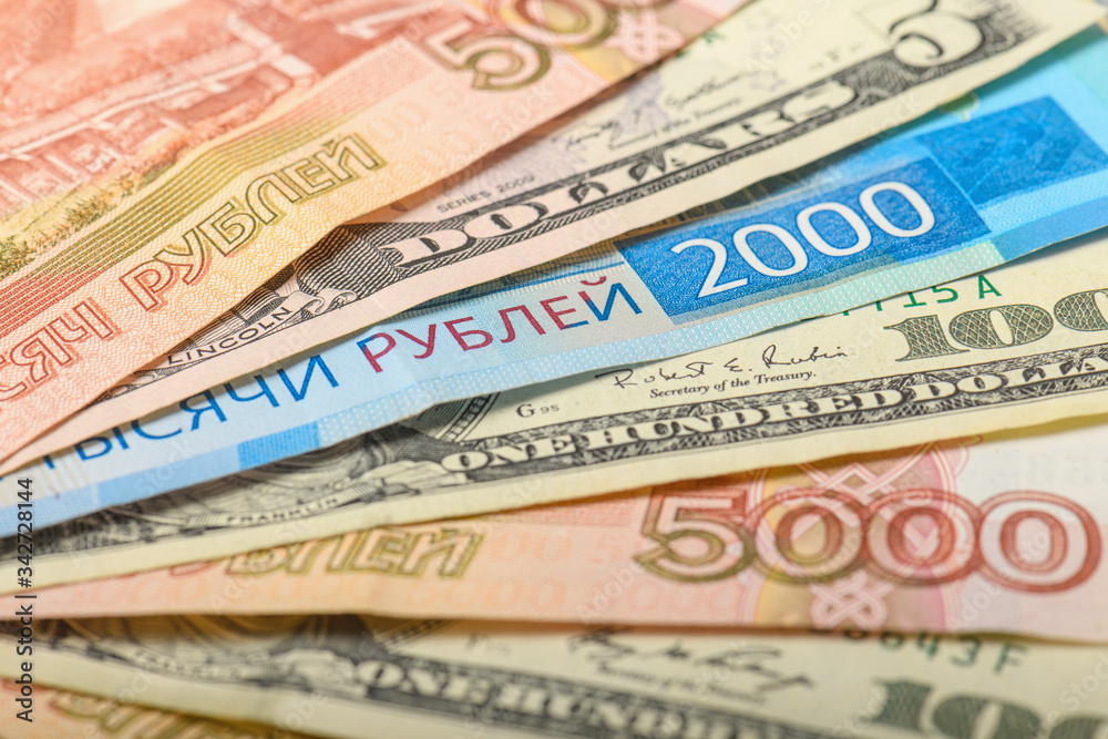 Cash banknotes background. The background of the American and Russian money banknotes. Dollars and rubles background. Cash banknotes background. The background of the American and Russian money banknotes. Dollars and rubles background.