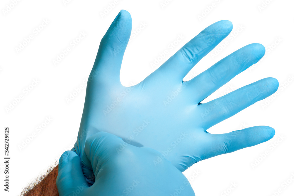Close up of hands wearing blue gloves isolated on a white background Close up of hands wearing blue gloves isolated on a white background