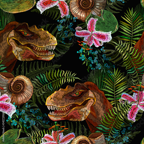 Tyrannosaurus rex head, orchid flowers and palm leaves. Seamless pattern. Embroidery. Tropical forest background. Archeology and paleontology. Template for clothes. Prehistoric life of dinosaurs