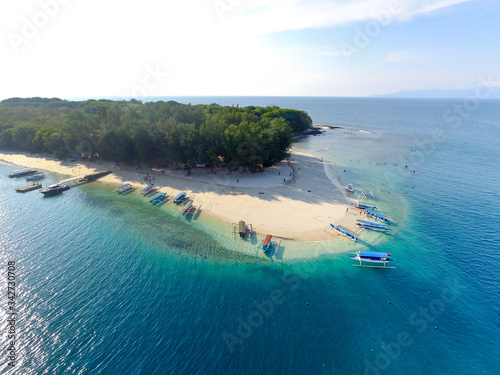 Lombok Indonesia, 4 July 2020: Boats at sea parking in Gili Trawangan Island. Aerial view of Gili Trawangan 