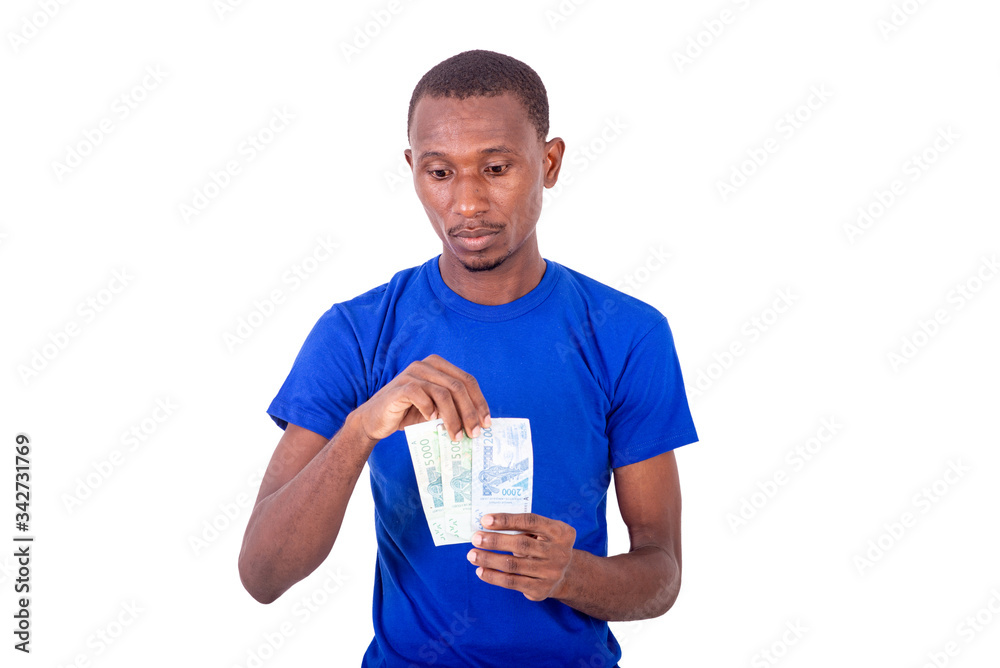 portrait of a young man holding banknotes, thoughtful portrait of a young man holding banknotes, thoughtful