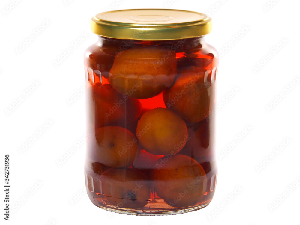 Plum compote in a glass jar isolated on white Plum compote in a glass jar isolated on white