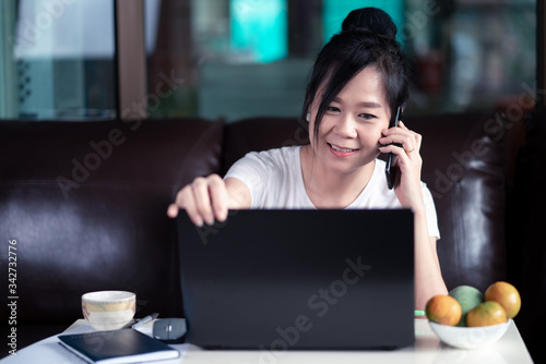 Woman working on laptop at home for protect for protect 2019 - nCov , covid 19 or corona virus.WFH or Working from home concept.