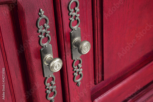 Brass door handles with ornate escutcheons photo