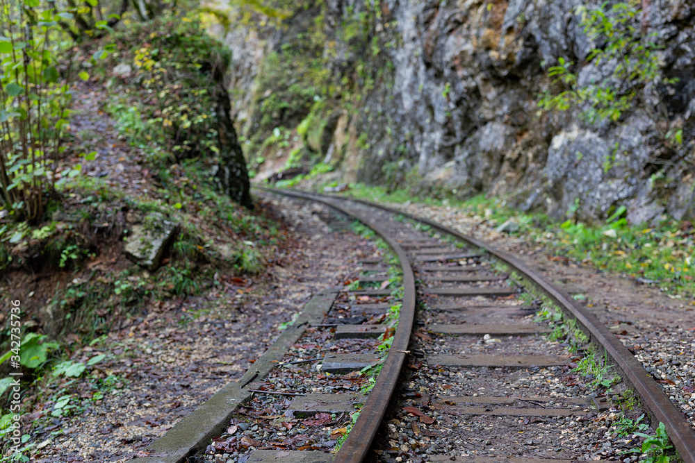 A old narrow gauge railway. A canyon Guamka, Russia, Krasnodar. A forest, a creek and rock at autumn. A old narrow gauge railway. A canyon Guamka, Russia, Krasnodar. A forest, a creek and rock at autumn.