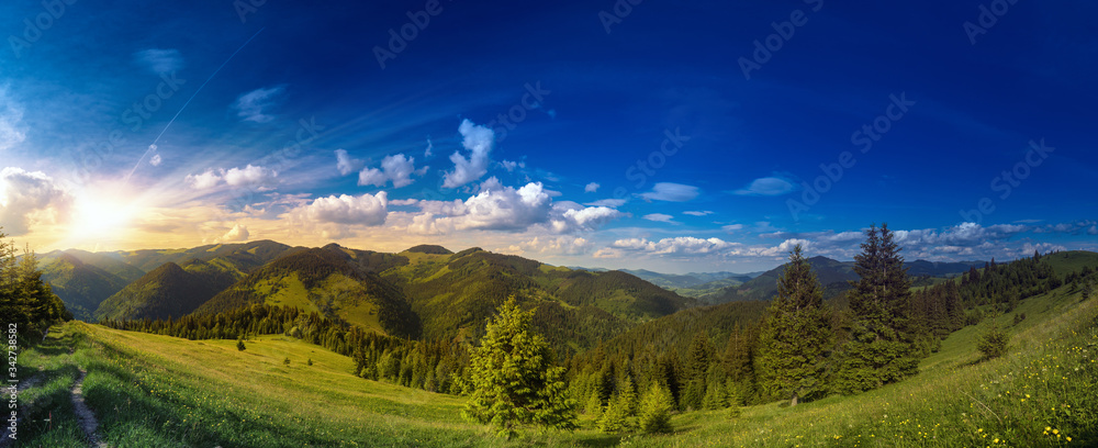 Sunset over carpathian mountains panorama. Majestic highland landscape