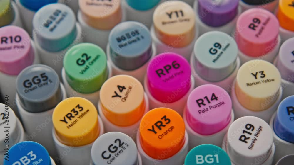 Top close up view on set of multiple colorful markers. Collection of professional illustrator or artist stationary tools, bright and colored markers for creative drawing Top close up view on set of multiple colorful markers. Collection of professional illustrator or artist stationary tools, bright and colored markers for creative drawing