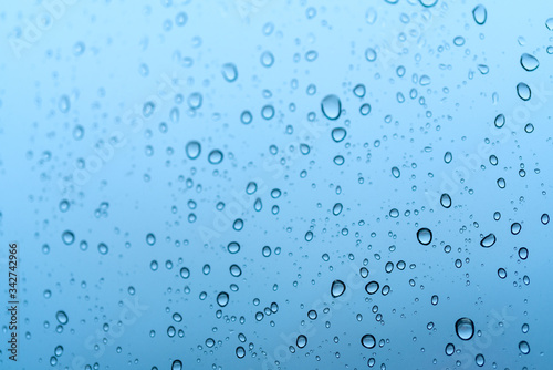 Water rain drops on glass window background. , Clear vapor water bubbles on window glass surface for your design.